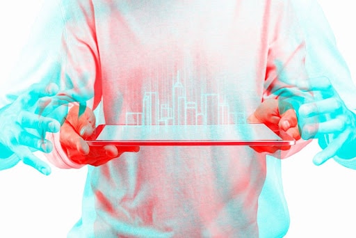 Person holding a tablet displaying a digital city skyline, representing technology trends in property management.