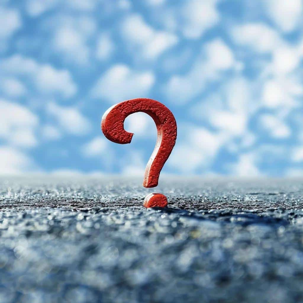 Red question mark symbol on a textured surface, representing inquiries about property management services in West Palm Beach.